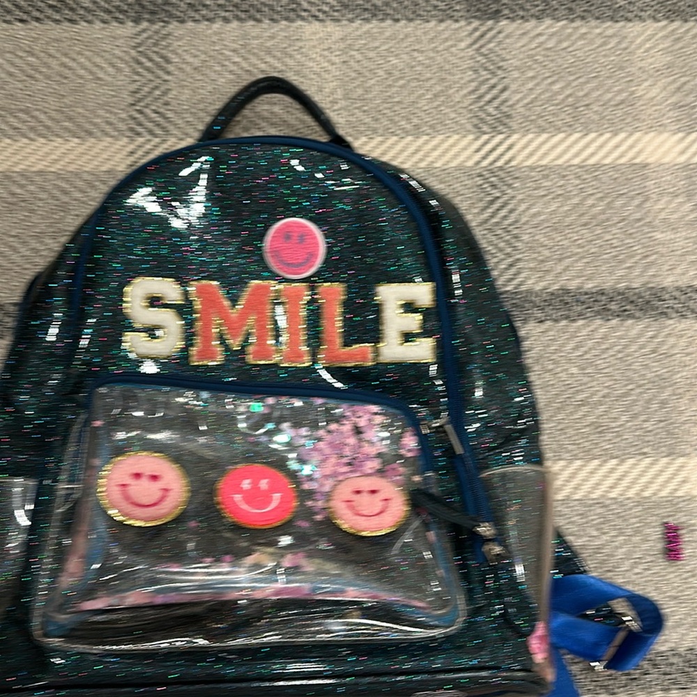 Glittering cute backpack for anything like school,vacation,and more. Never used.